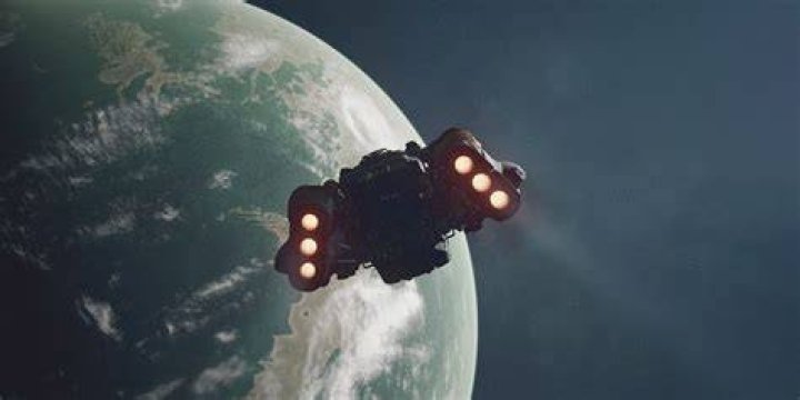 Starfield: a spaceship flying behind an astronaut's shoulder.